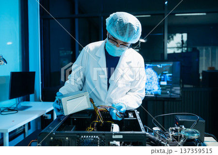 IT engineer repairing computer server hardware in laboratory. Electronics diagnostics, motherboard maintenance, cybersecurity infrastructure and data center 137359515