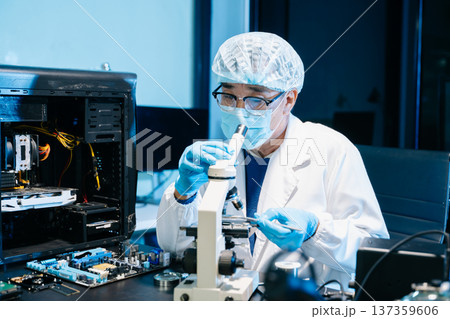 IT technician using microscope to inspect a motherboard in a modern lab. Electronics repair, precision work, troubleshooting, and system diagnostics IT technician using microscope to inspect a motherboard in a modern lab. Electronics repair, precision work, troubleshooting, and system diagnostics 137359606
