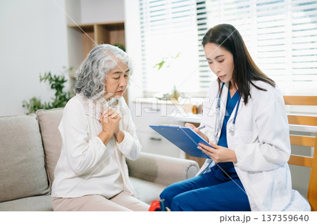 Female doctor explaining heart health with anatomy model to senior woman. Healthcare, cardiology, medical consultation, elderly care, prevention Female doctor explaining heart health with anatomy model to senior woman. Healthcare, cardiology, medical consultation, elderly care, prevention 137359640