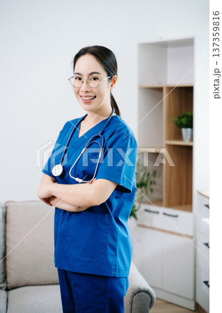 Confident Asian nurse in blue scrubs with stethoscope. Professional healthcare worker portrait for hospital, clinic, medical service, wellness 137359816