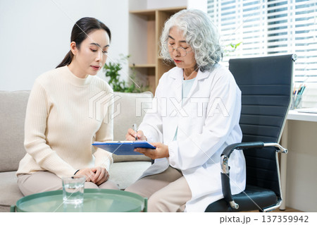 Psychiatrist comforting stressed patient during mental health therapy. Psychology counseling, emotional support, depression and anxiety treatment Psychiatrist comforting stressed patient during mental health therapy. Psychology counseling, emotional support, depression and anxiety treatment 137359942