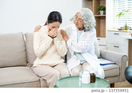 Psychiatrist comforting stressed patient during mental health therapy. Psychology counseling, emotional support, depression and anxiety treatment 137359951