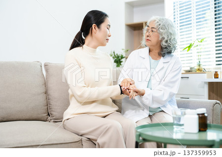 Psychiatrist comforting stressed patient during mental health therapy. Psychology counseling, emotional support, depression and anxiety treatment Psychiatrist comforting stressed patient during mental health therapy. Psychology counseling, emotional support, depression and anxiety treatment 137359953