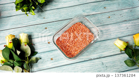 Red Lentils (Masoor Dal) in Glass Container on Wooden Background Red Lentils (Masoor Dal) in Glass Container on Wooden Background 137361284