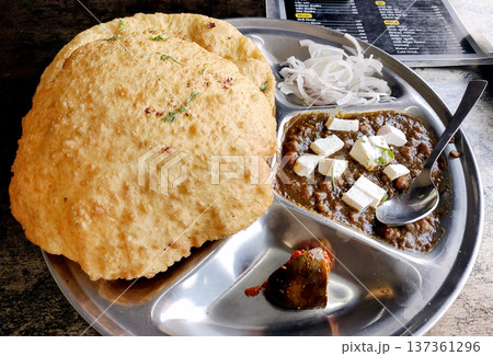 Chole bhature is a North Indian famous food dish. Chole bhature is a North Indian famous food dish. 137361296