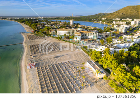 Aerial scene a beach with sun loungers, hotels, trees, water near Mallorca town in Balearic Islands, Spain 137361856