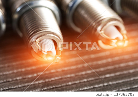 Automotive spark plugs with glowing electrode tips ignition system component for engine power generation and vehicle performance. Automotive spark plugs with glowing electrode tips ignition system component for engine power generation and vehicle performance. 137363708