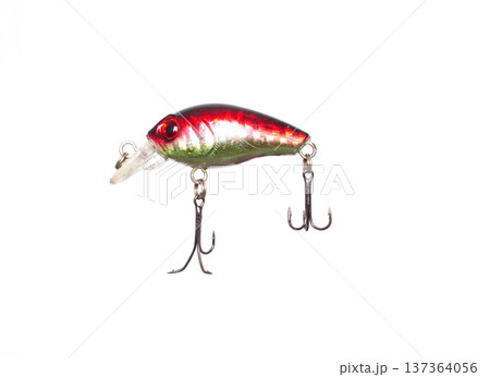 Brightly colored fishing lure, red and green, with two sharp treble hooks and clear plastic lip, isolated against pristine white background 137364056