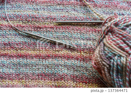 Cozy Handmade Knitting Scene with Colorful Wool Yarn Balls and Wooden Needles Cozy Handmade Knitting Scene with Colorful Wool Yarn Balls and Wooden Needles 137364471