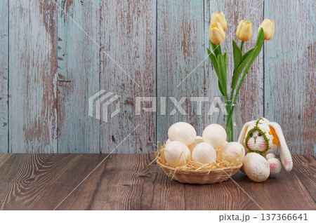 Easter bunny with white eggs and tulips in vase Easter bunny with white eggs and tulips in vase 137366641