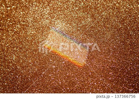 Gold glitter background with rainbow prism sparkle and shimmering bokeh texture for festive design 137366756