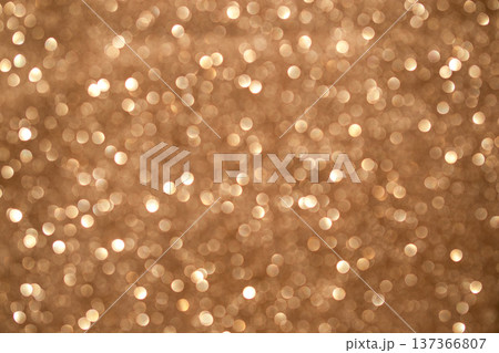 Gold bokeh glitter background with warm shimmer and soft sparkle for festive luxury and celebration designs Gold bokeh glitter background with warm shimmer and soft sparkle for festive luxury and celebration designs 137366807