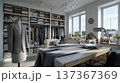 Stylish Tailoring Studio with Elegant Fashion Displays and Shelving, Featuring Sewing Machines and Q 137367369