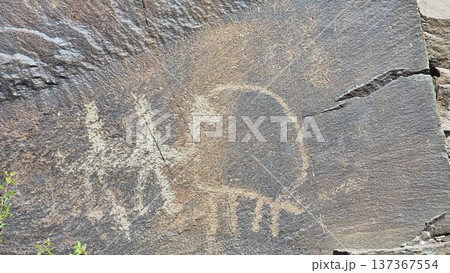 Rocks in the mountains. Stones with petroglyphs.  137367554