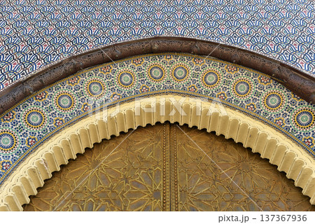Brass door with Arabic calligraphy and Moroccan zellij mosaic tilework. Royal Palace, Fez, Morocco 137367936