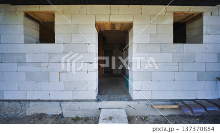 Unfinished doorway in a house under construction made of aerated concrete blocks Unfinished doorway in a house under construction made of aerated concrete blocks 137370884
