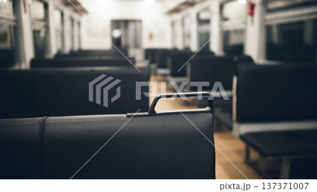 Empty train car interior with black seats for public transportation and commute Empty train car interior with black seats for public transportation and commute 137371007