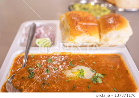Pav Bhaji Indian spicy fast food with bread, onion and butter, Indian food, Mumbai food Pav Bhaji Indian spicy fast food with bread, onion and butter, Indian food, Mumbai food 137371170