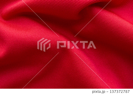 Red sports clothing fabric football shirt jersey texture close up Red sports clothing fabric football shirt jersey texture close up 137372787