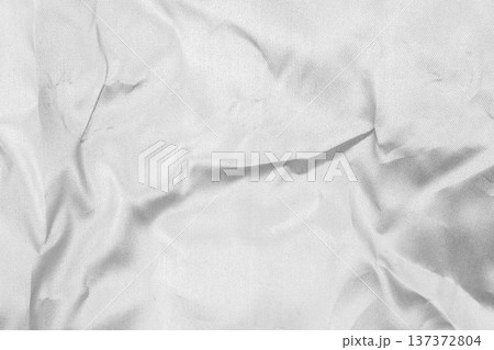 Crumpled shiny silver fabric metal texture background Crumpled shiny silver fabric metal texture background 137372804