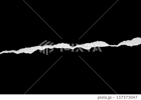 Ripped torn paper edges isolated on black background Ripped torn paper edges isolated on black background 137373047