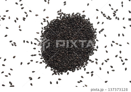 Black sesame seeds isolated on white background Black sesame seeds isolated on white background 137373128