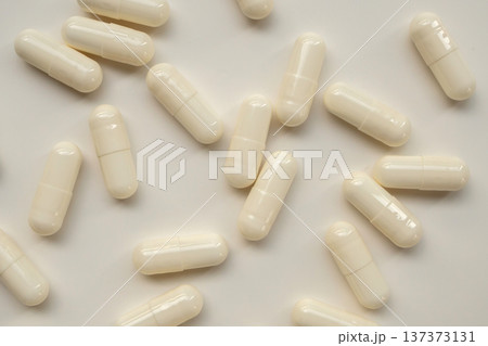 White medicine pills capsule on white background White medicine pills capsule on white background 137373131