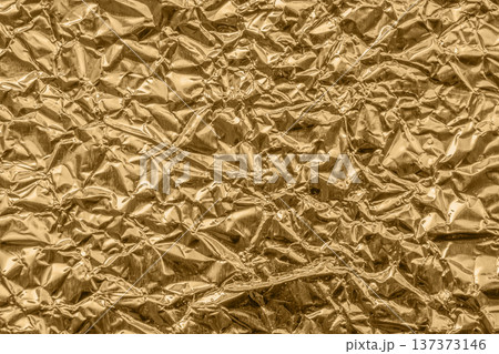 Luxury shiny metallic bronze foil crumpled texture background Luxury shiny metallic bronze foil crumpled texture background 137373146