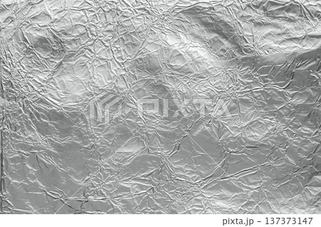 Shiny metal silver gray foil leaf crumpled texture background Shiny metal silver gray foil leaf crumpled texture background 137373147