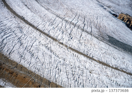 Pers Glacier in the Bernina Range captures the beauty of the Alps with its intricate ice formations and rugged mountain backdrop. 137373686