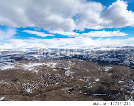 Winter vista: snowy peaks, sunlit valleys 137374236