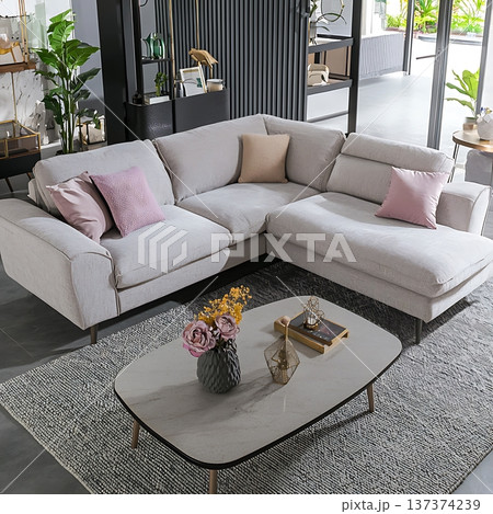 White sectional sofa with pink pillows 137374239