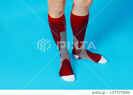 low angle view of a man wearing compression socks low angle view of a man wearing compression socks 137375680