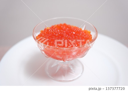 Orange fish roe Red Caviar rotating background. Close-up salmon caviar rotating. Delicatessen. Texture of caviar. Backdrop. Macro shoot Orange fish roe Red Caviar rotating background. Close-up salmon caviar rotating. Delicatessen. Texture of caviar. Backdrop. Macro shoot 137377720