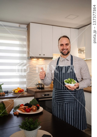 Man chef showing organic Brussels sprouts giving thumbs up Man chef showing organic Brussels sprouts giving thumbs up 137377864