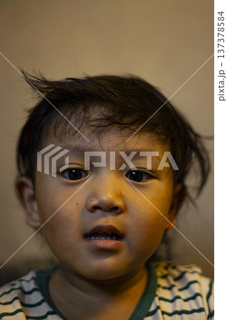 Portrait Of A Toddler, Candid and expressive portrait of a young toddler capturing pure childhood innocence, ideal for parenting, family advertising and child care promotion. Portrait Of A Toddler, Candid and expressive portrait of a young toddler capturing pure childhood innocence, ideal for parenting, family advertising and child care promotion. 137378584