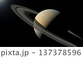 Saturn planet with prominent ring system floating in deep space with scattered stars and cosmic darkness background 137378596