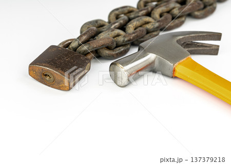 Hammer and locked padlock isolated on white background 137379218