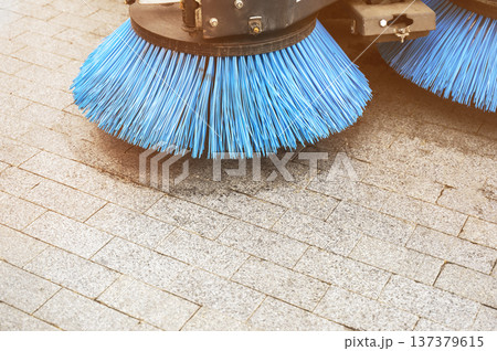 Close up of a blue circular brush on a professional street cleaning machine 137379615