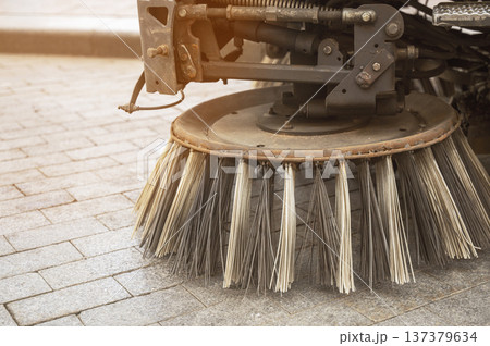Close up of a blue mechanical brush on a professional street cleaning machine 137379634