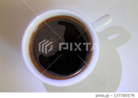 Abstract image of a coffee cup with a piece of paper. Abstract image of a coffee cup with a piece of paper. 137380576