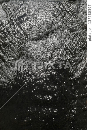 Water ripples on a stormy river. Water ripples on a stormy river. 137380597