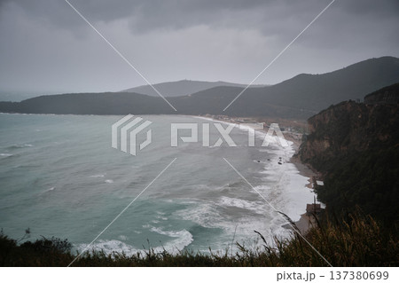 Dramatic Coastal Bay with Waves and Mountainous Shoreline Dramatic Coastal Bay with Waves and Mountainous Shoreline 137380699
