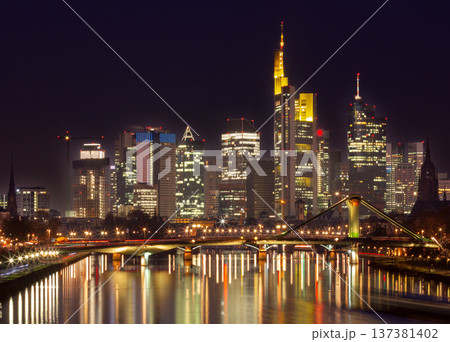 Frankfurt am Main skyline with bridge over Main river at dusk Frankfurt am Main skyline with bridge over Main river at dusk 137381402