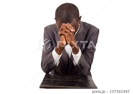 portrait of young man praying. 137381497