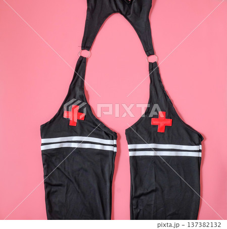 Cosplay women's underwear on color background. 137382132