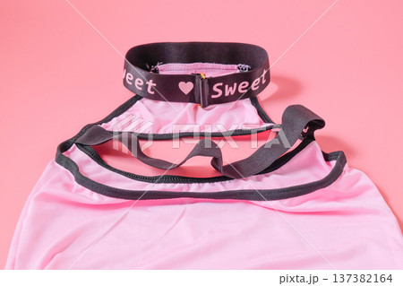 Cosplay women's underwear on color background. Cosplay women's underwear on color background. 137382164
