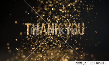 Golden text sparks float in the air with a message of gratitude in a dim light setting 137385017