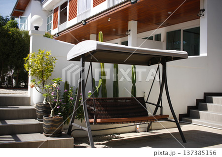 Garden bench, swing in hotel resort terrase, relax zone Garden bench, swing in hotel resort terrase, relax zone 137385156
