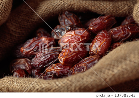 Dates in burlap bag. Dates in burlap bag. 137385343